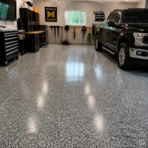 A finished flake floor coating in a Michigan garage showing how long epoxy flooring lasts