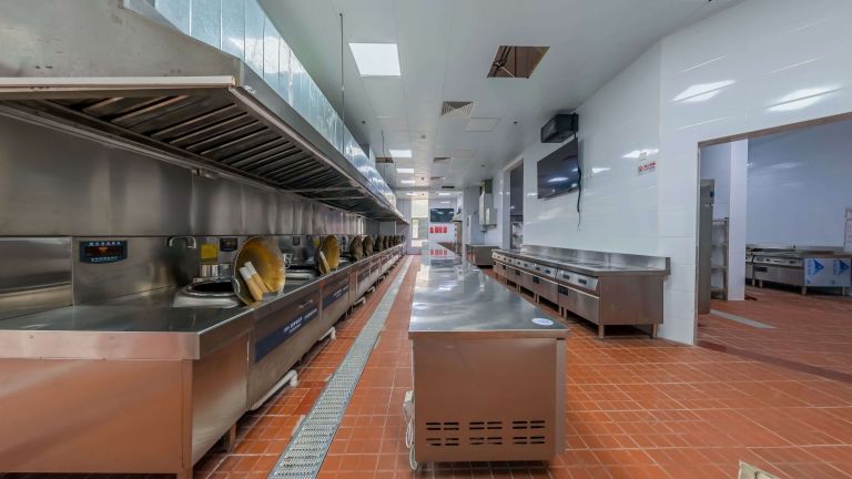 A restaurant kitchen floor coating designed for grease and slip resistance